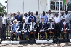 A guest of honor and a working group taking a group photo